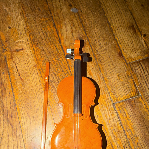 Brown toy violin with - brown,