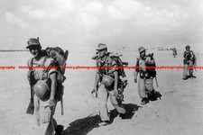 F027261 German soldiers march on foot to forward positions El Alamein front 1942