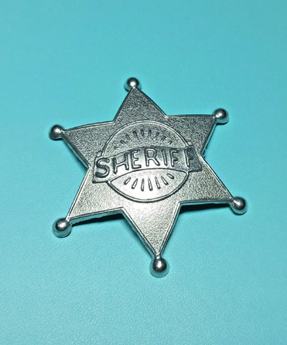 Vintage metal sheriff badge.