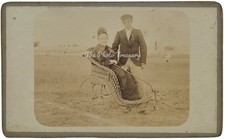 CDV ELDERLY LADY WICKER INVALID CHAIR WITH ATTENDANT AT BEACH MEDICAL INTEREST 