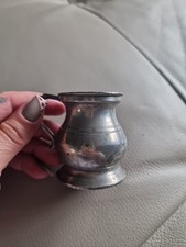 Antique pewter half-gill measure.