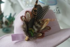 pheasant feather and bullet brooch, hat pin, wedding buttonhole.