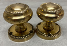 Sprung Georgian-style brass door knobs rope-edge design for mortice / rim lock