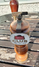 Vintage wood and brass beer tap with stella artois brass sign