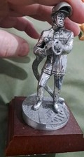  Pewter Fireman With Hose On Wooden Base
