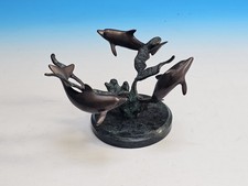3 Bronze ? Swimming Dolphins