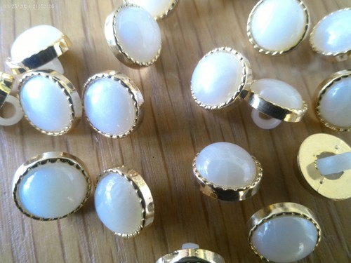 Gold rimmed faux ivory - faux,