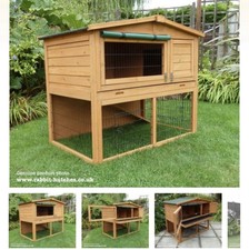 Wooden Hutch with Waterproof Cover. Lots of Openings and Great Space for Pets