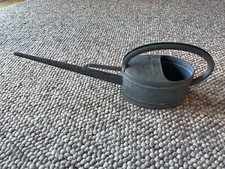 Antique watering can