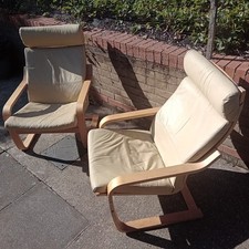 Ikea Poang chair, beige faux leather cover with a beech veneer frame.