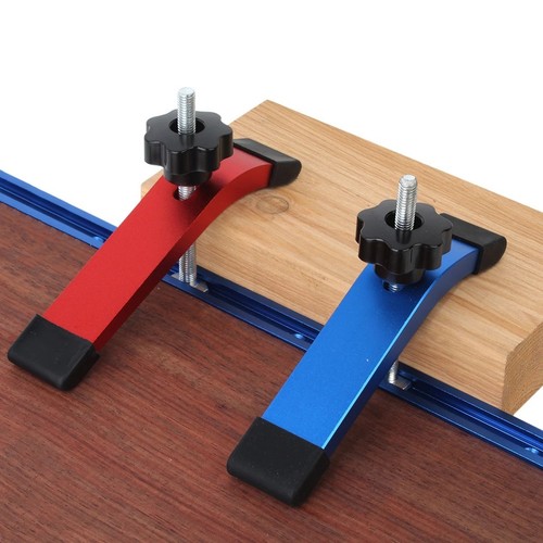 Quick acting track hold down - track,