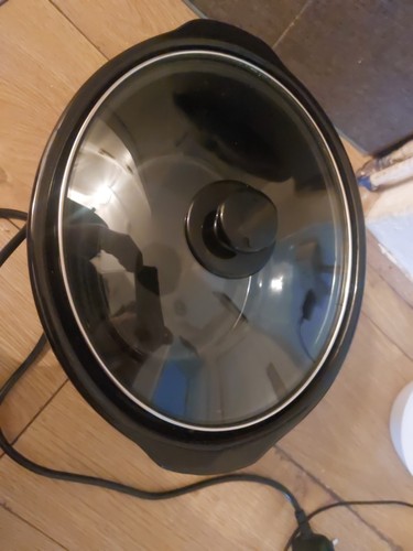 Slow cooker with tempered - cooker,