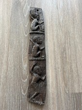 vintage african wall hanging of carved figures
