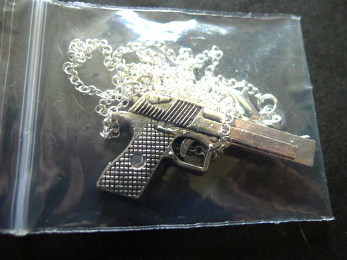 Silvered gun pendant with - gun,