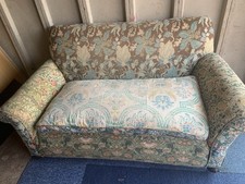 Uniquely Upholstered Drop End Antique Sofa