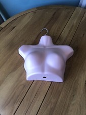 Woman Hanging Mannequin Head And Shoulders