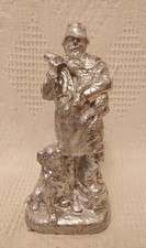 Silver coloured farmer feeding - coloured,