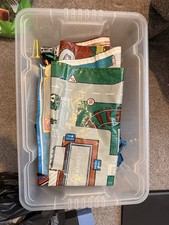 A Box Of Car Toys And Car Mat