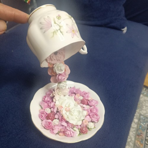 Floating cup and - and, saucer