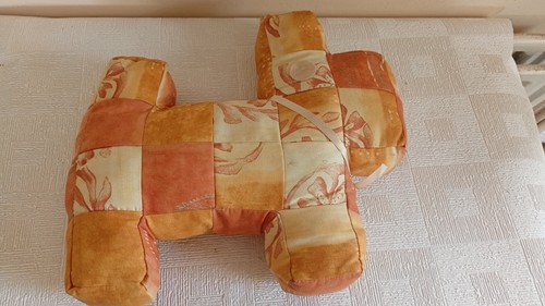 Patchwork cushion shaped a - shaped, as