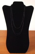 Two long black metal chain necklaces which can be worn separately or together
