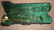 Cecilio Trombone complete with mouthpiece and case (all battered but working)