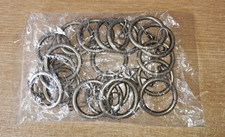 ONE BAG OF GOLD COLOURED METAL CURTAIN POLE RINGS
