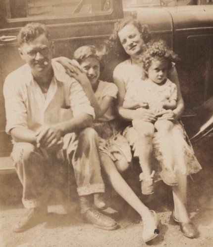 1930s family sitting against - family,
