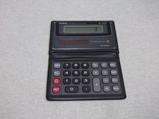 Vintage 1980s CASIO SL-100B Solar Powered Wallet Calculator