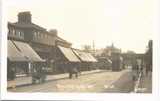 Balham High Road # 7 by Johns. Tram to Tooting & Merton. Sandwich Board Man.