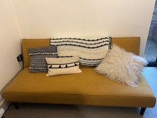 mustard yellow sofa bed from