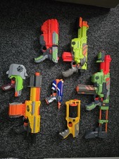 Nerf Gun Bundle 7x Nerf Guns, darts And Disks  Included. green, blue, yellow 