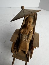Hand-carved wooden rickshaw