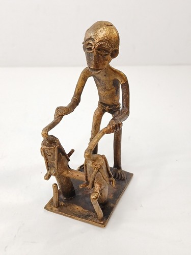 Brass figure playing conga - playing,