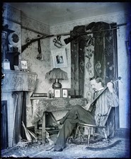 Man Seated Playing Banjo-Like