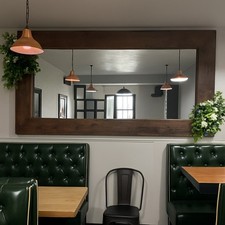 Very large and heavy wooden rustic mirror 8ft x 4ft flowers not included.