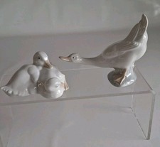 Two Relaxing White Ducks Plus One Long Neck White Duck by Daisa Nao/LLadro