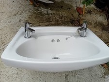 Wall Hung Washbasin  With Taps And Brackets. Has A Chip, See Photo.