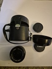 Canon FD 50 mm f/1.4 Lens + Hood + Caps + Case – Excellent Condition