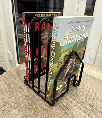 Black metal book - book, rack