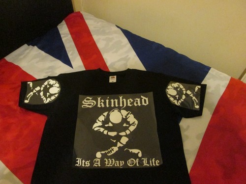 Skinhead shirt sitting its - t, a