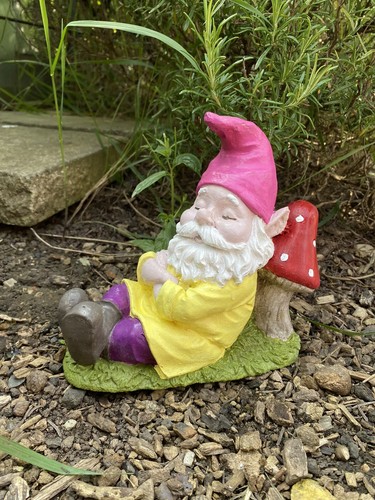 Garden gnome chilling against - gnome,