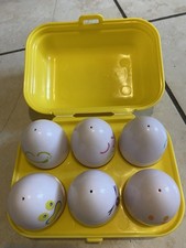 Tomy Yellow Eggs Box Hide N Squeak Baby Toy