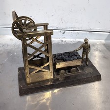 Vintage Brass Figurine Depicting A Coal Miner With A Pit Head And Coal Cart