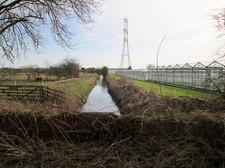 Photo A1 Western  Drain  passing  commercial  greenhouses Dunswell/TA07 c2015