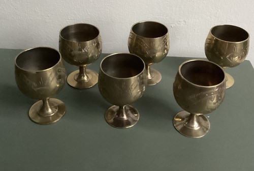 Six small brass goblets with - six,