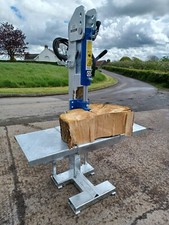 Tractor mounted hydraulic log