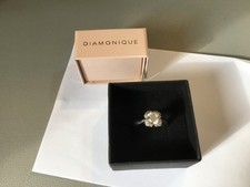 A pre owned Diamonique DQCZ 925 size Q-R square central stone ring