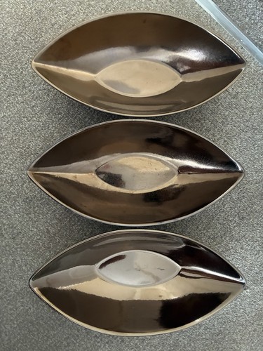 Bronze coloured boat - boat, shaped