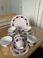 VINTAGE COLCLOUGH PINK 21 PIECE TEA SET DECORATED WITH ROSES AND A GOLD TRIM